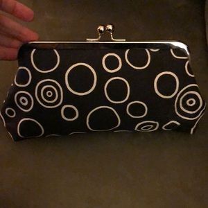 Black and white clutch with red inside